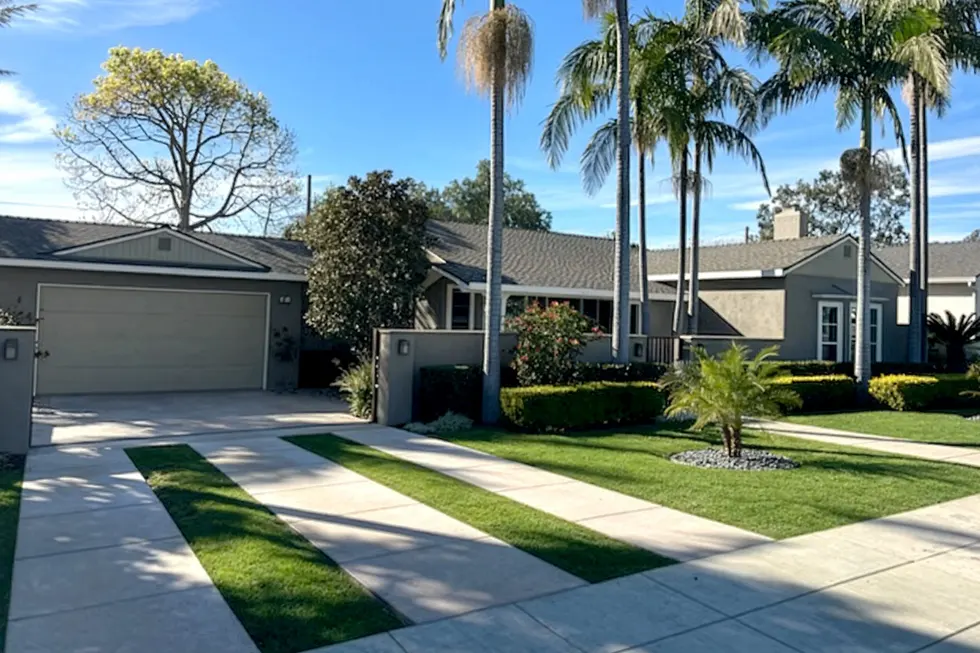 Freshly painted single-story home exterior in Midtown Ventura California with clean driveway and palm trees