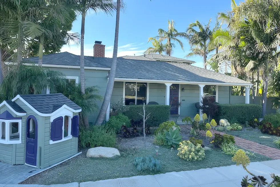 Midtown Ventura California home with fresh exterior paint, front garden landscaping, and matching children’s playhouse