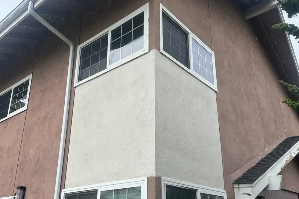 Exterior house paint color sample on stucco wall in Midtown Ventura California showing test patch for new color selection