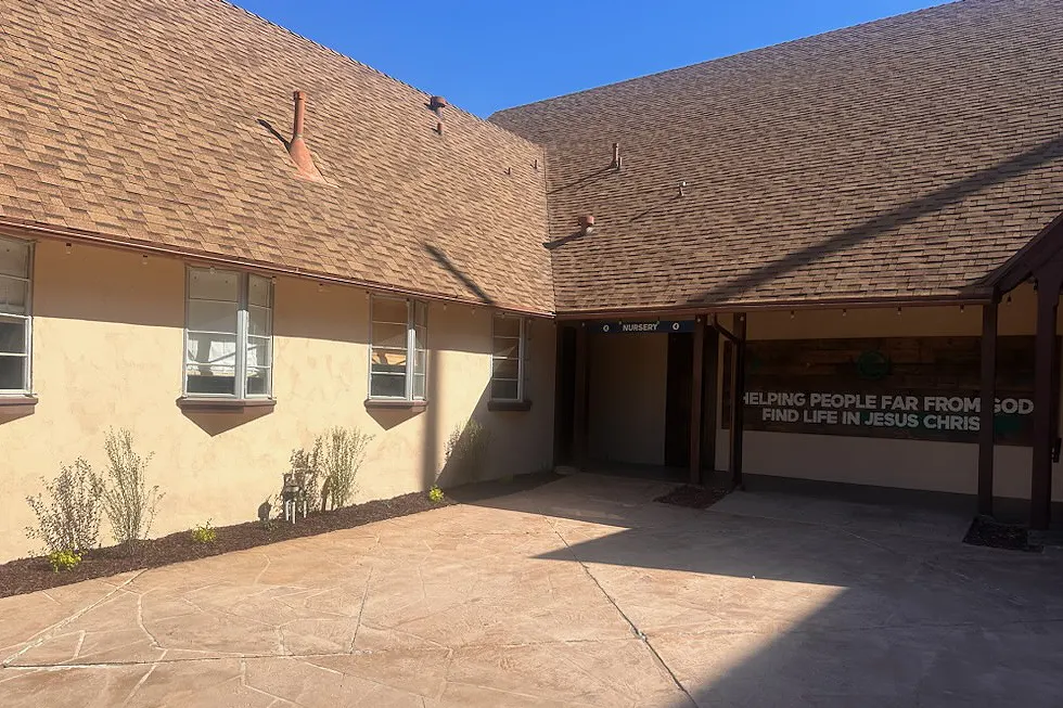 Freshly painted stucco courtyard at Catalyst Church in Santa Paula California with clean walkways and updated exterior
