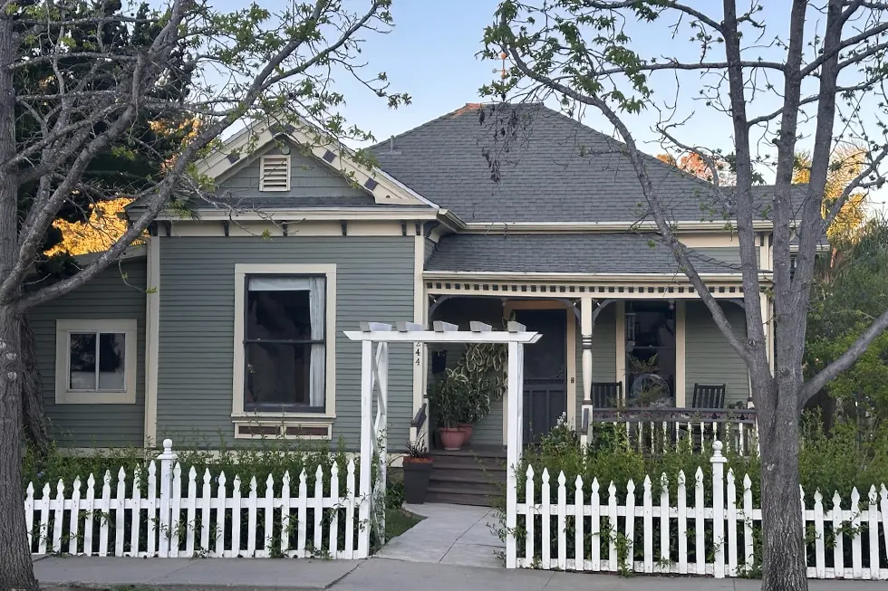 Victorian home exterior painting in Santa Paula CA with green siding and white trim using premium paint